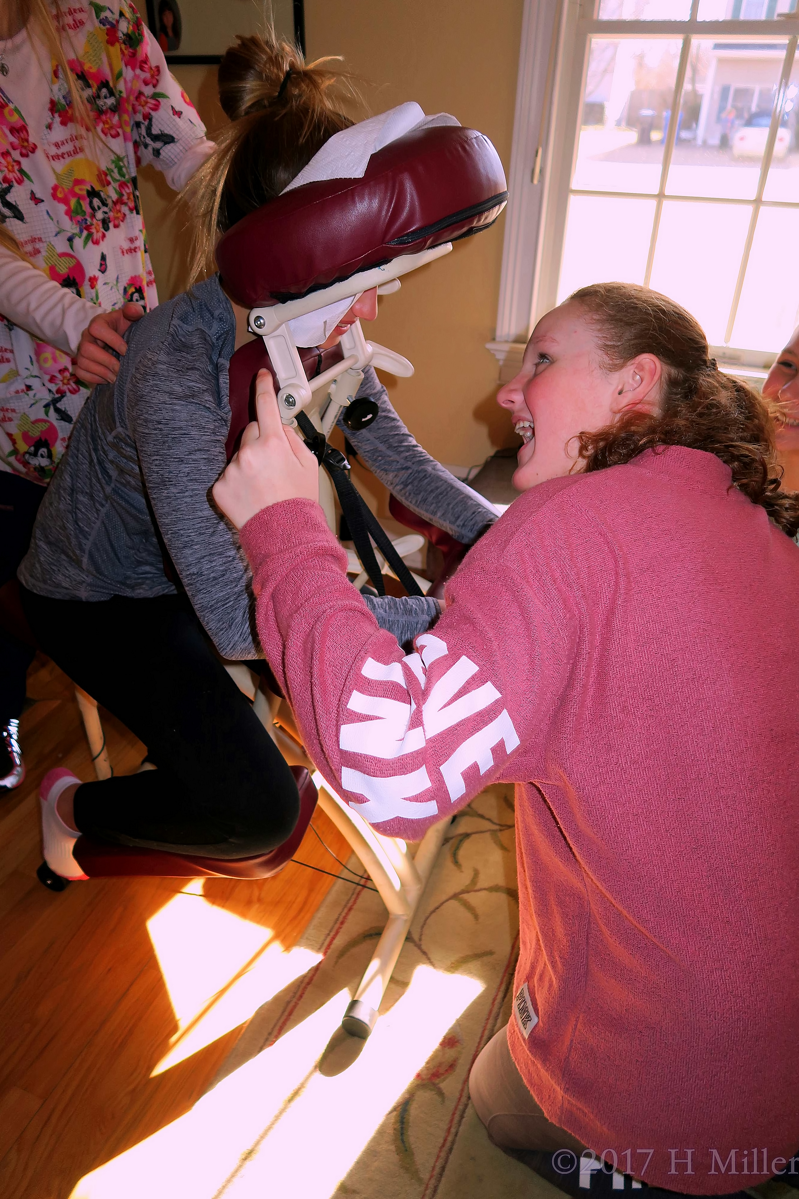 Party Guests Chatting Through The Peephole On The Massage Chair