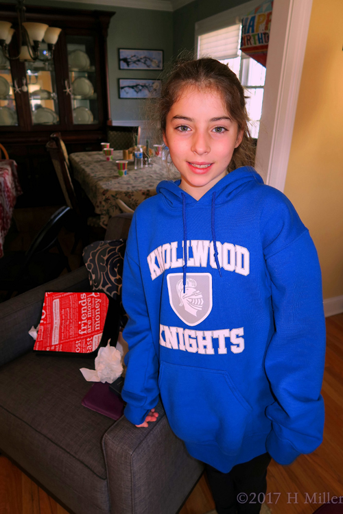 Party Guest In Royal Blue Posing During Her Sister's Spa Party. Party Guest In Royal Blue Posing During Her Sister's Spa Party.