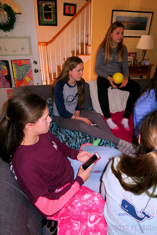 Phones And Party Guests Partaking In Group Chat