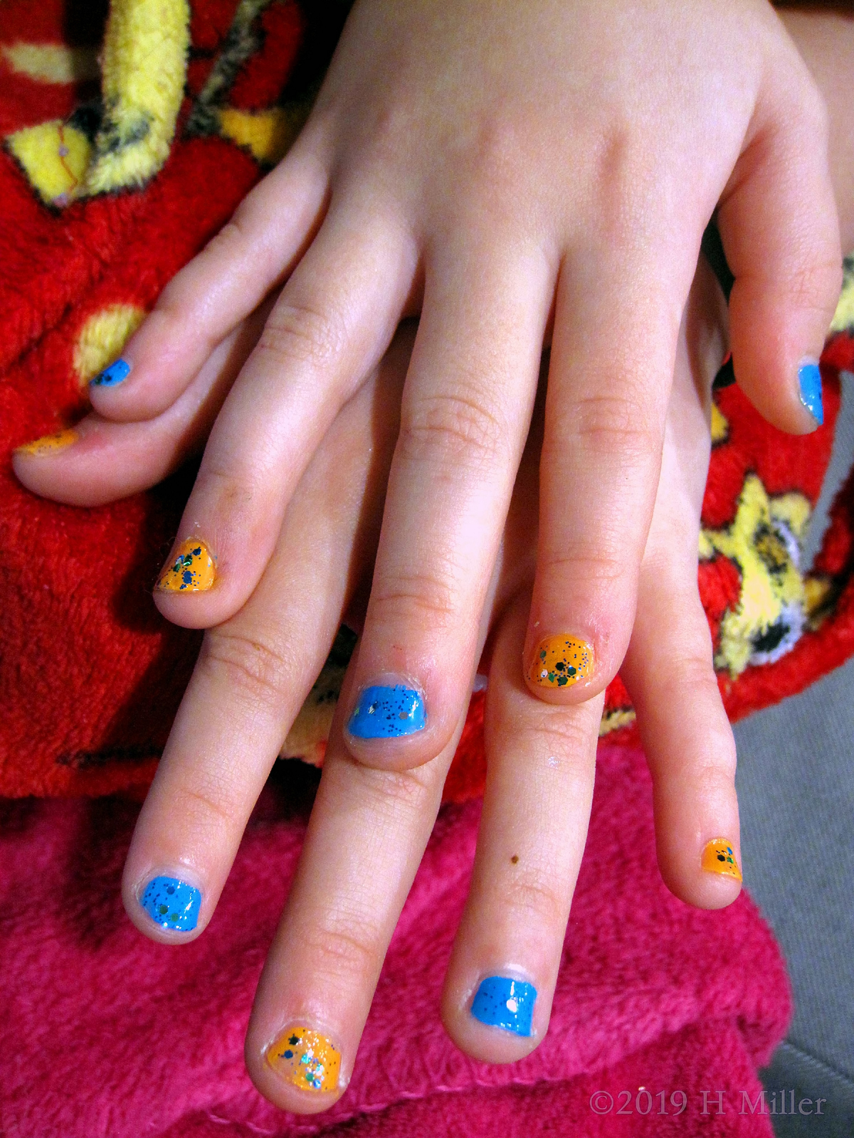 Kids Manicure Blue With Silver Glitter And Yellow With Stars And Glitter