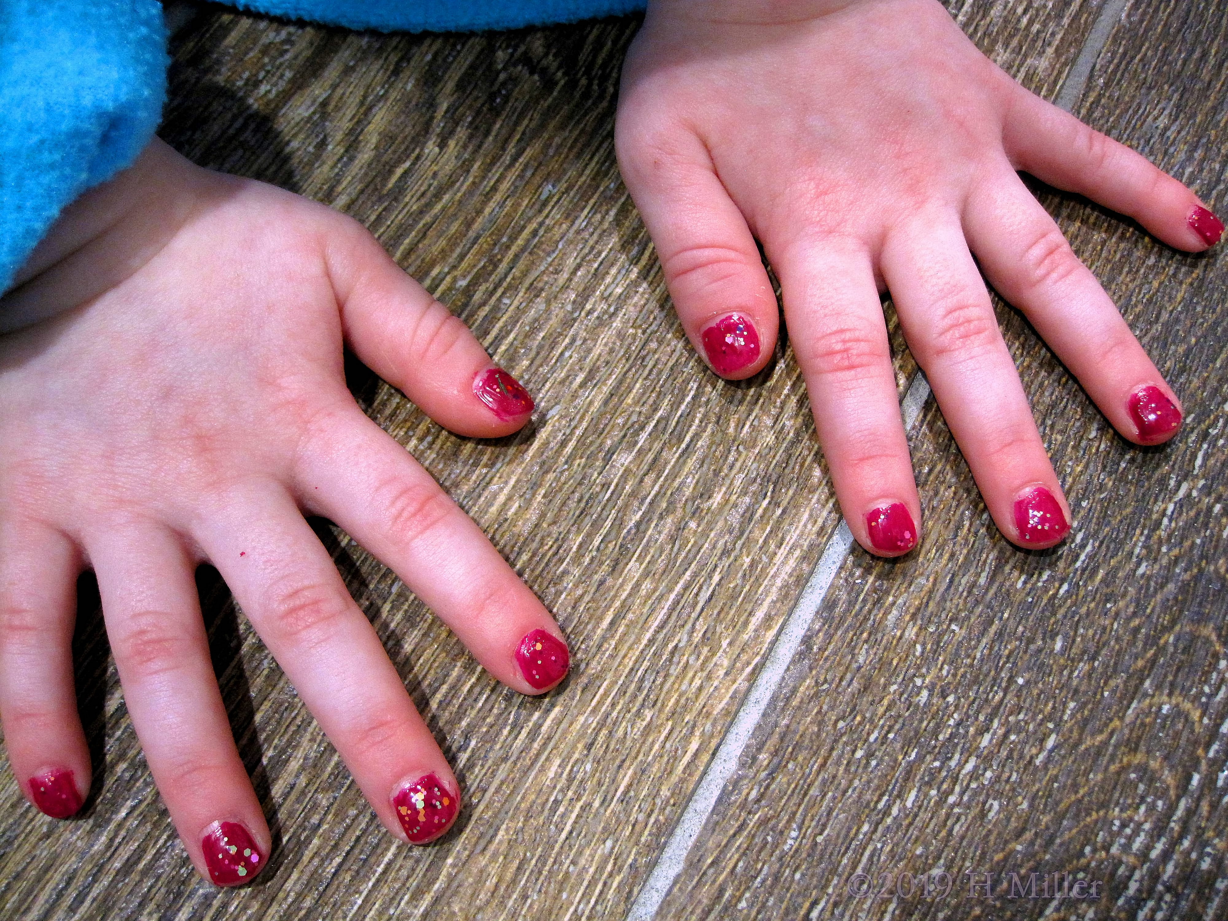 Kids Manicure Red Glossy Polish With Multicolored Glitter Kids Manicure Red Glossy Polish With Multicolored Glitter