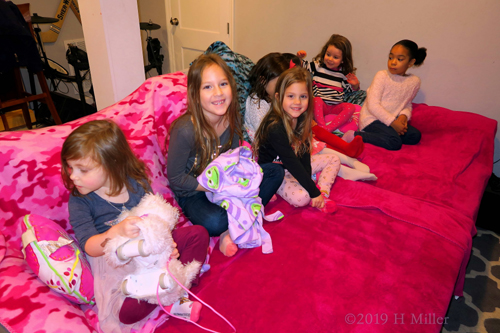 Birthday Girl Smiling With Friends At The Kids Spa Party Birthday Girl Smiling With Friends At The Kids Spa Party