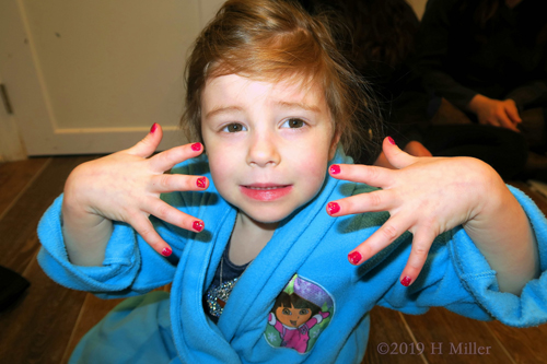 Spa Party Guest In Dora Kids Spa Robe Showing Her Girls Mini Mani