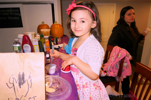 Spa Party Guest Smiling While Creating Bath Salts Crafts For Kids!