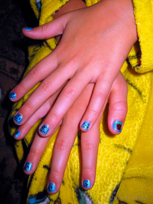 Blue Glitter Polish With Seeds And Strawberries For A Kids Mani With Nail Art