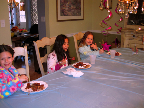 Chocolate And Chats! Party Guests Eat At The Table Chocolate And Chats! Party Guests Eat At The Table