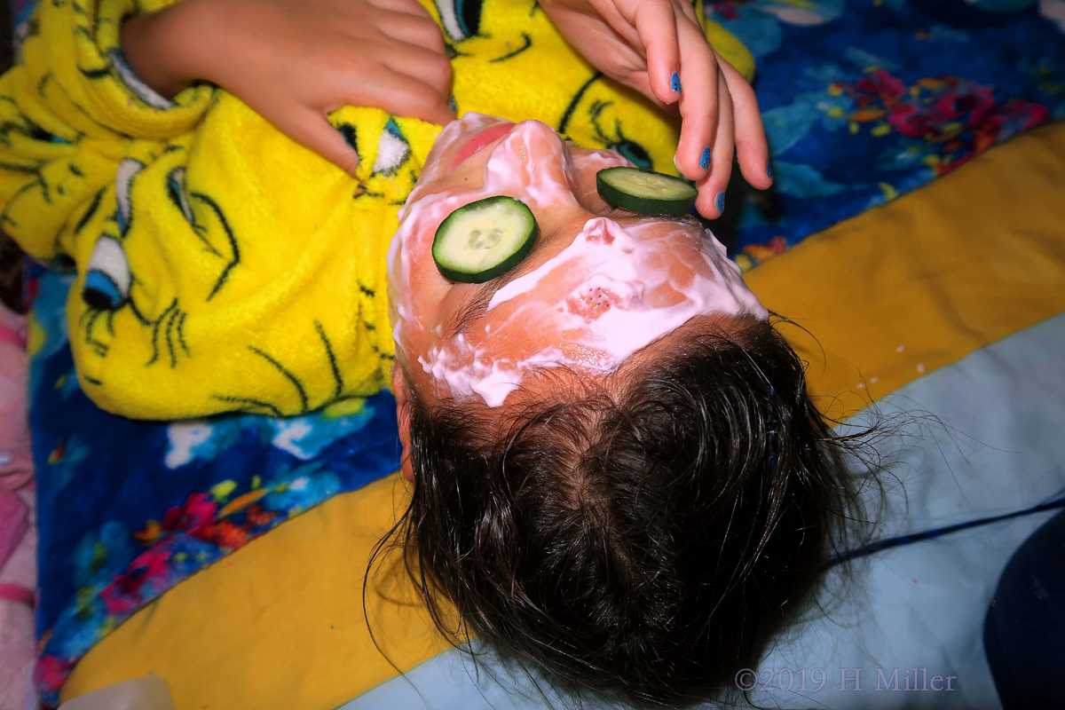 Glowing! Spa Party Guest Adjusts Cucumbers During Kids Facial! Glowing! Spa Party Guest Adjusts Cucumbers During Kids Facial!