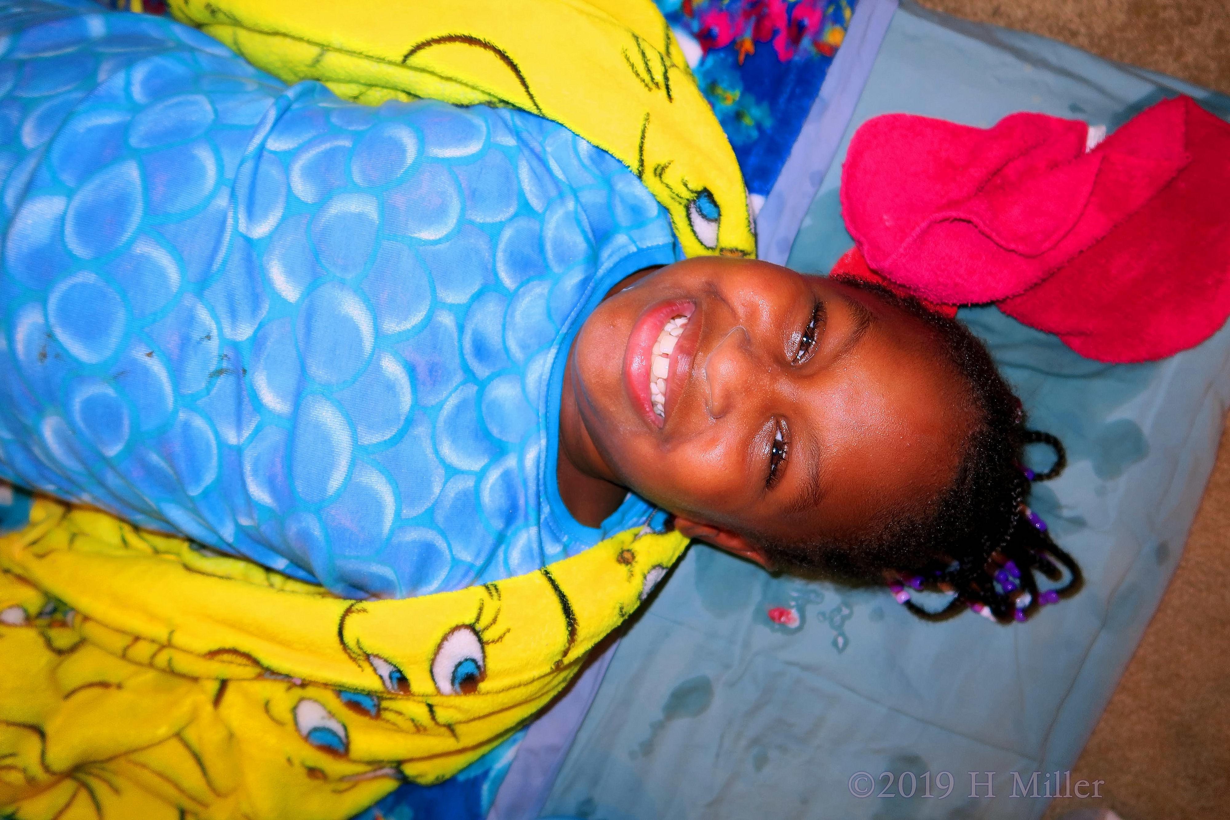 Beaming In Yellow! Party Guest Poses For Kids Facial! Beaming In Yellow! Party Guest Poses For Kids Facial!