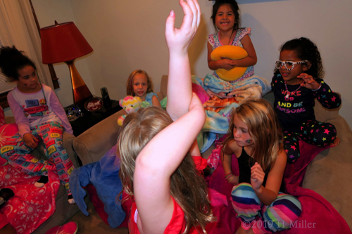 Hands Up For Happiness! Spa Party Guests Gather Around The Couch!