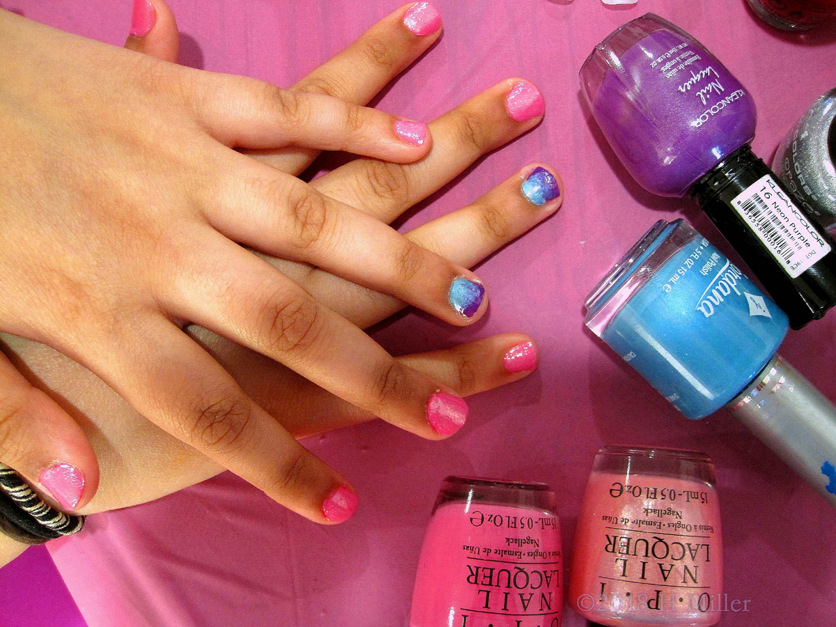 Beautiful Pink Girls Manicure Along With An Ombre Nail Design Of Purple And Blue