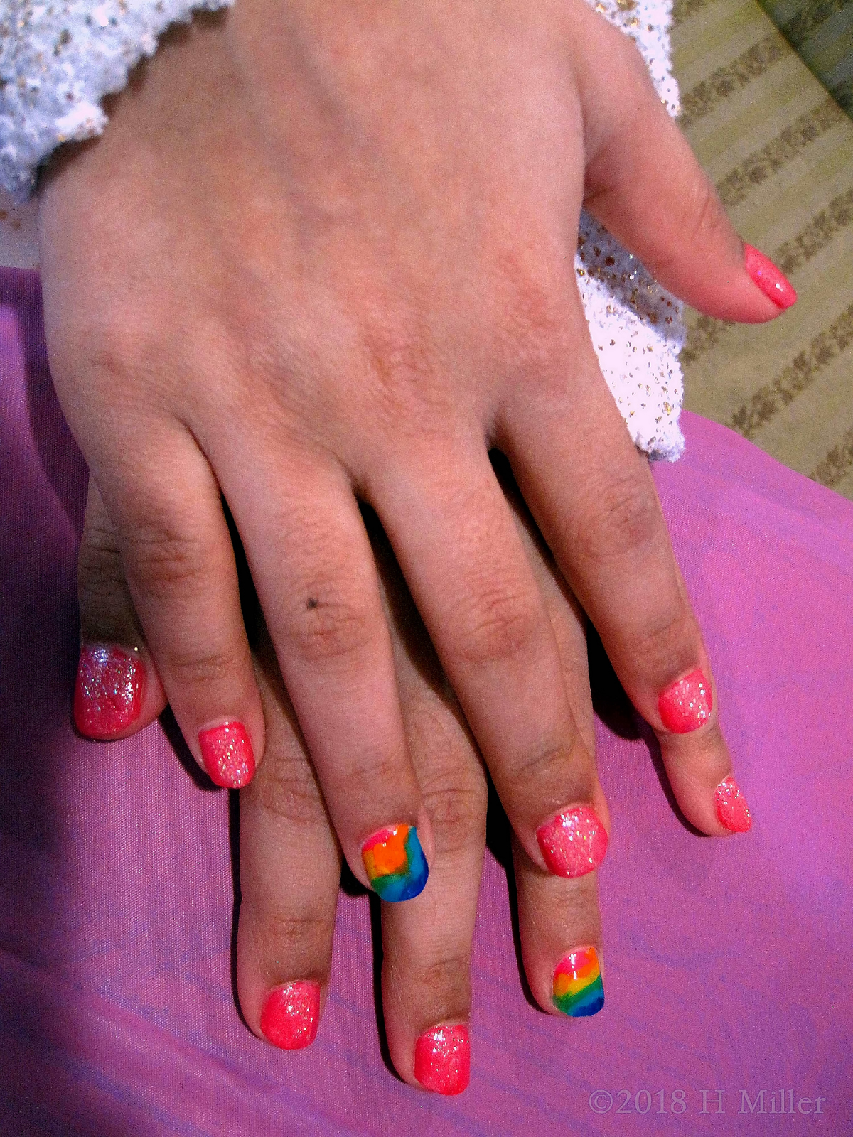 Close Up Of Rainbow Nail Art On This Girls Manicure! 