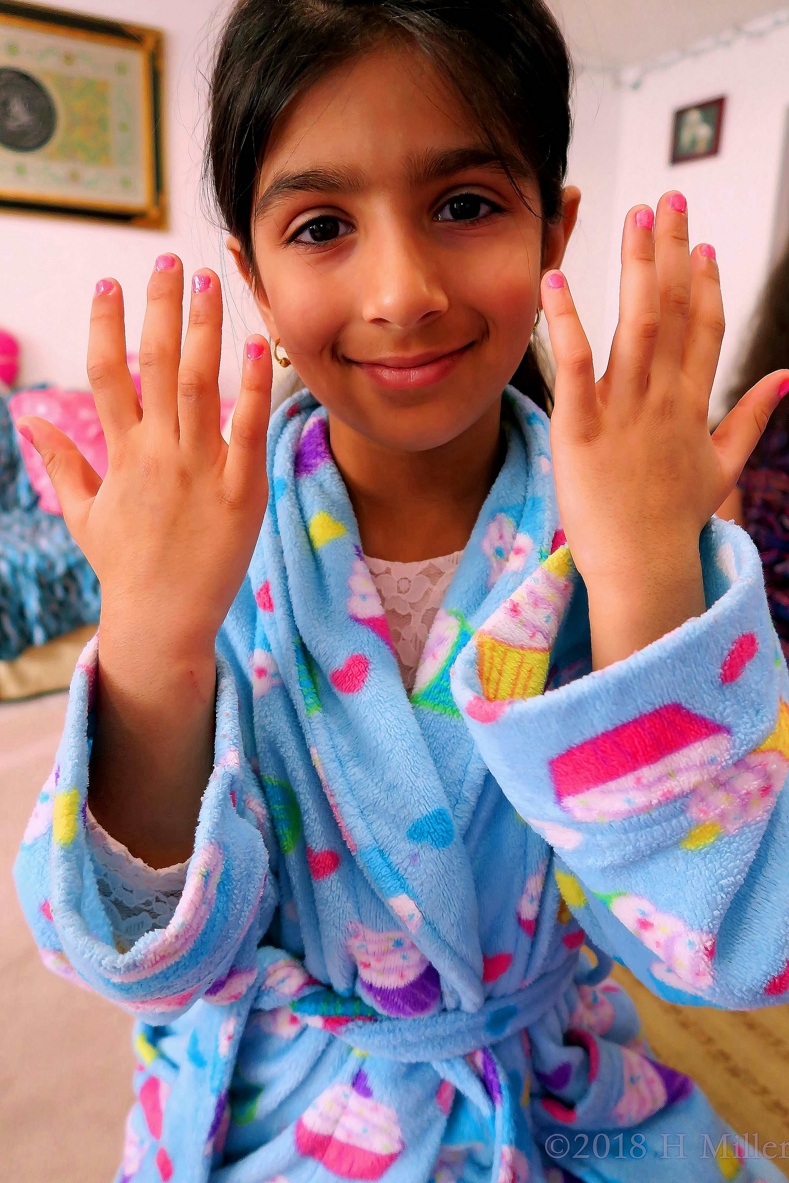 She Is In A Cute Blue Spa Robe Showing Her Kids Manicure She Is In A Cute Blue Spa Robe Showing Her Kids Manicure