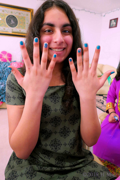 Showing Her Cool Girls Manicure With Glittery Accent Nail And A Smile