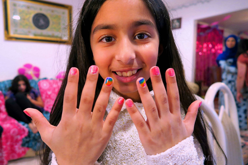 The Birthday Girl Is Showing Her New Mini Mani With A Smile