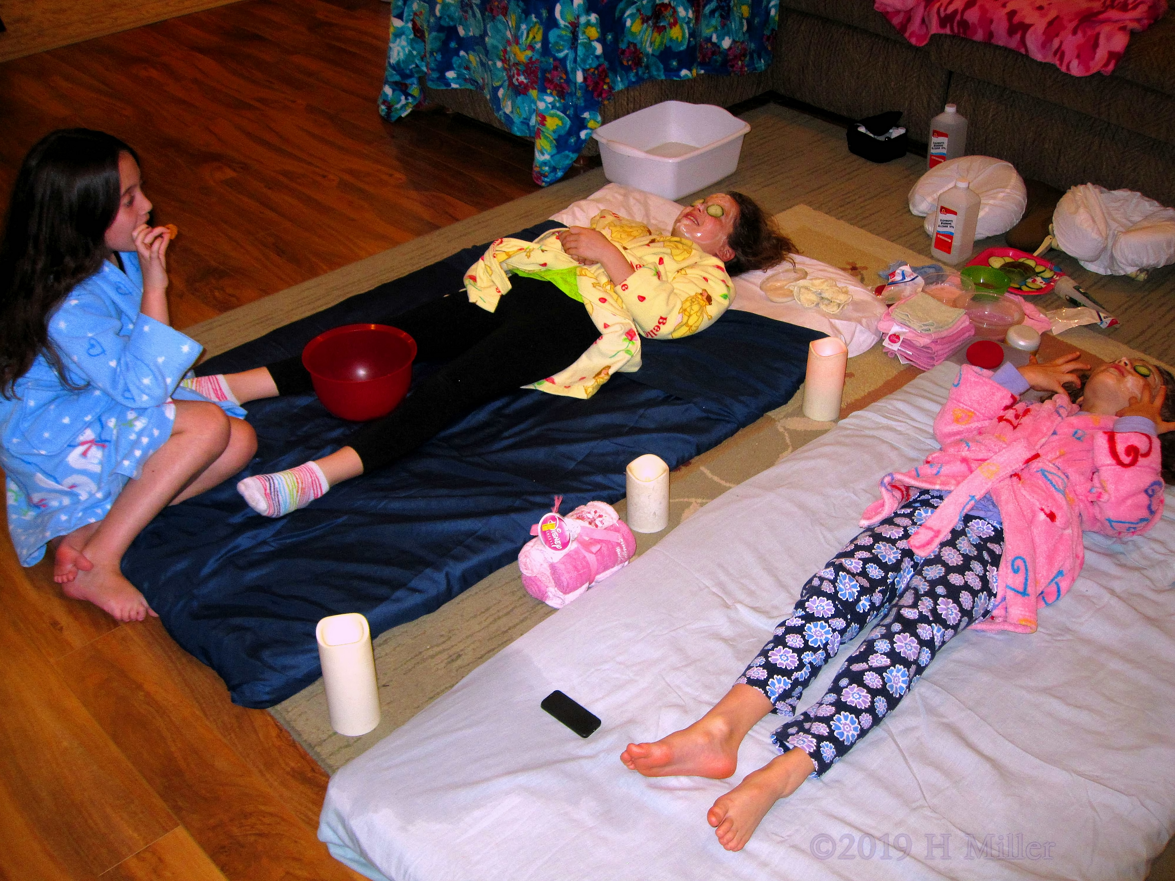 Snacking And Relaxing! Party Guests Lay Back Enjoying Kids Facial! 