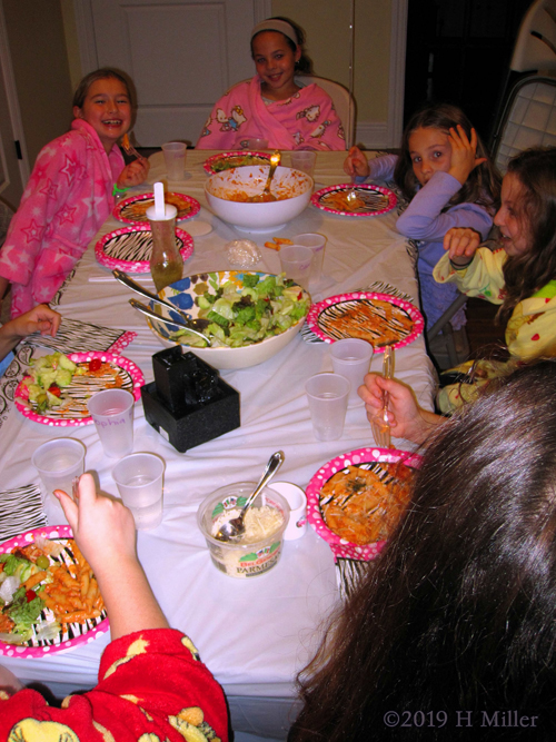 Meal Time! Party Guests Enjoy Their Pasta And Salad!