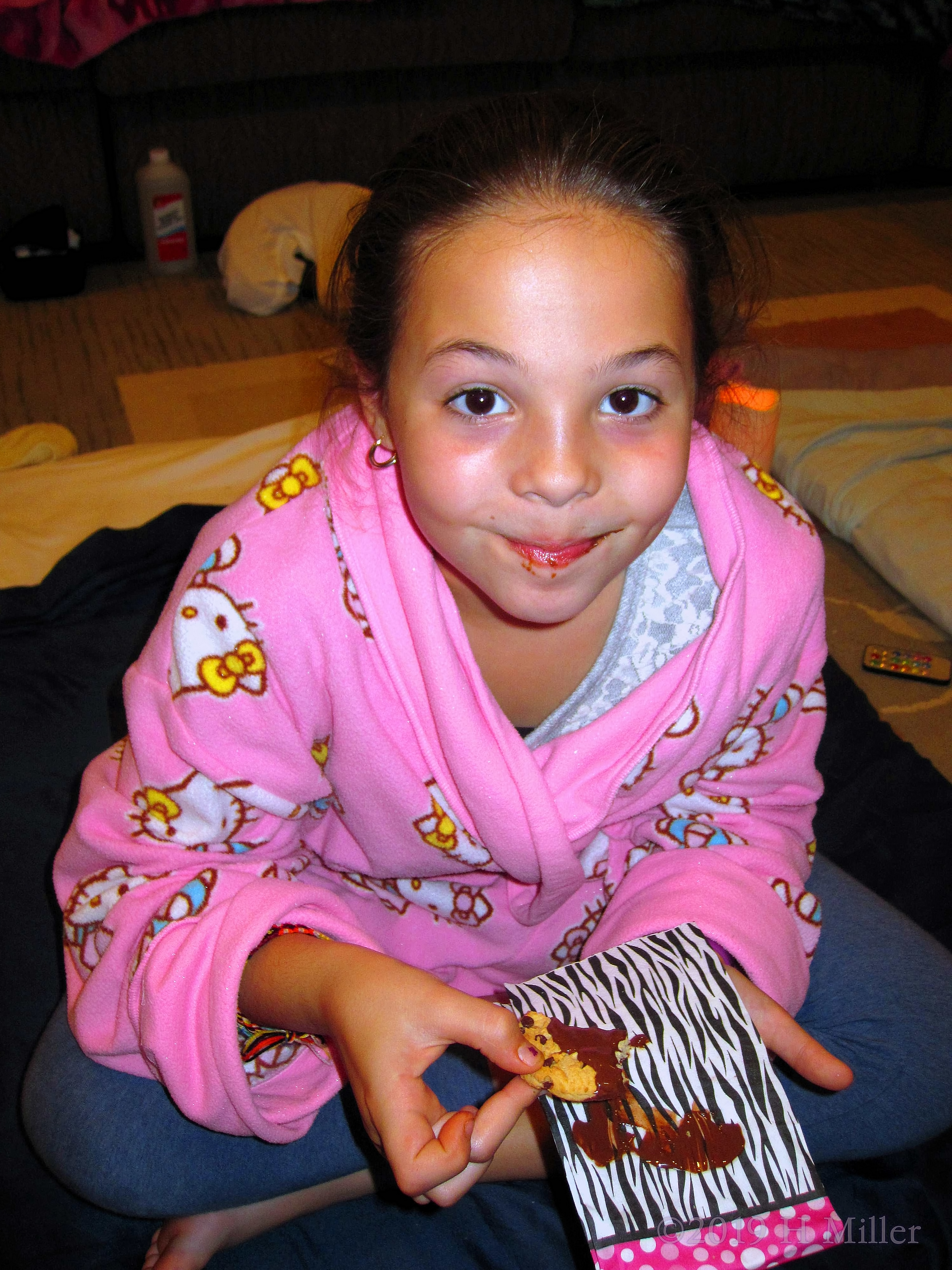 Birthday Girl Enjoys A Cookie Dipped In Chocolate Fondue!