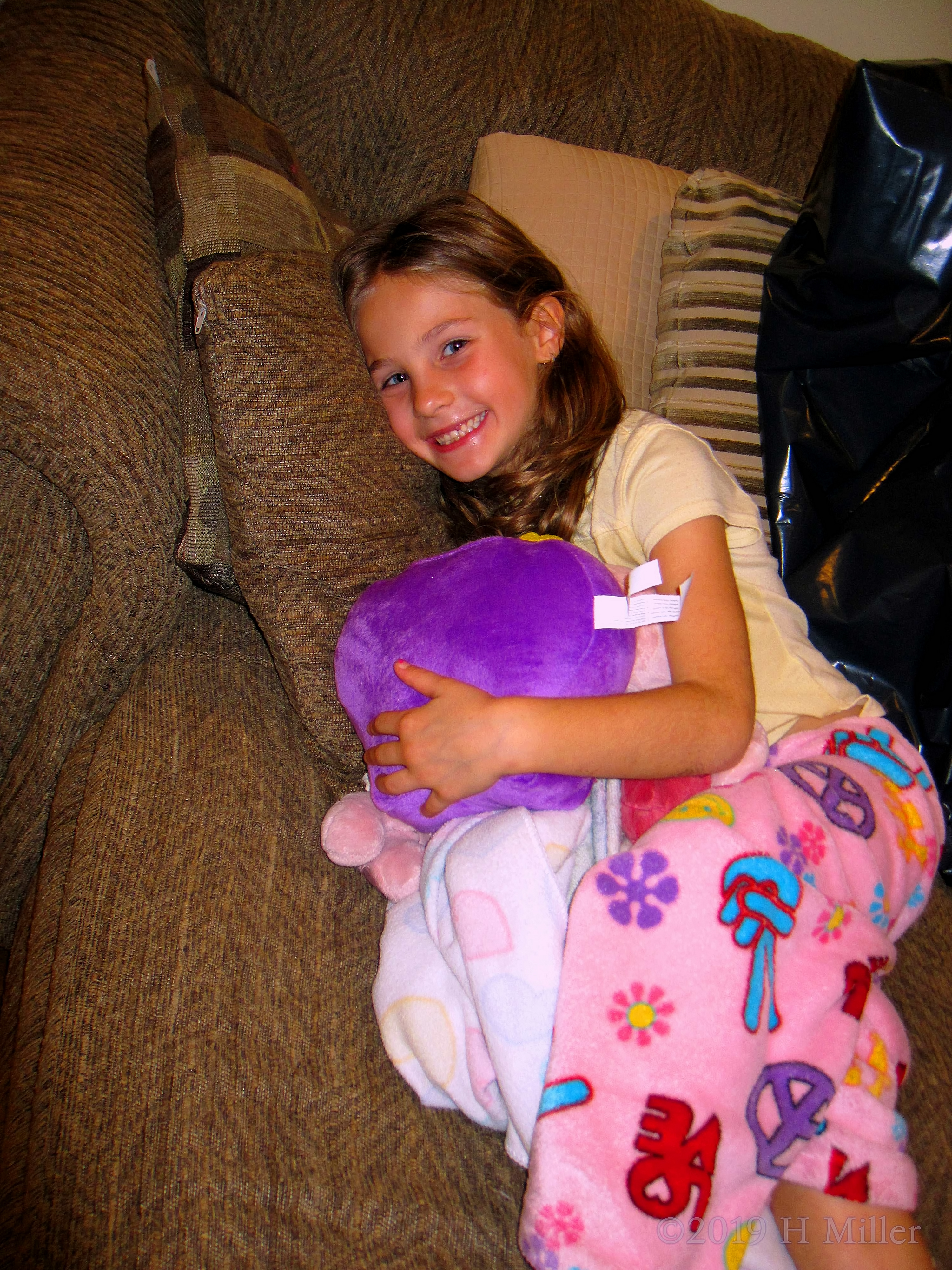 Pillows And Pajamas! Party Guest Looks Comfortable On The Couch! 