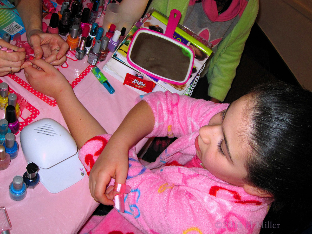 Getting Her Cute Home Kids Spa Manicure Done. 