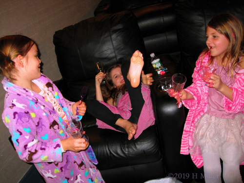 The Birthday Girl And Her Friends Enjoying Their Mini Manicures And Pedicures