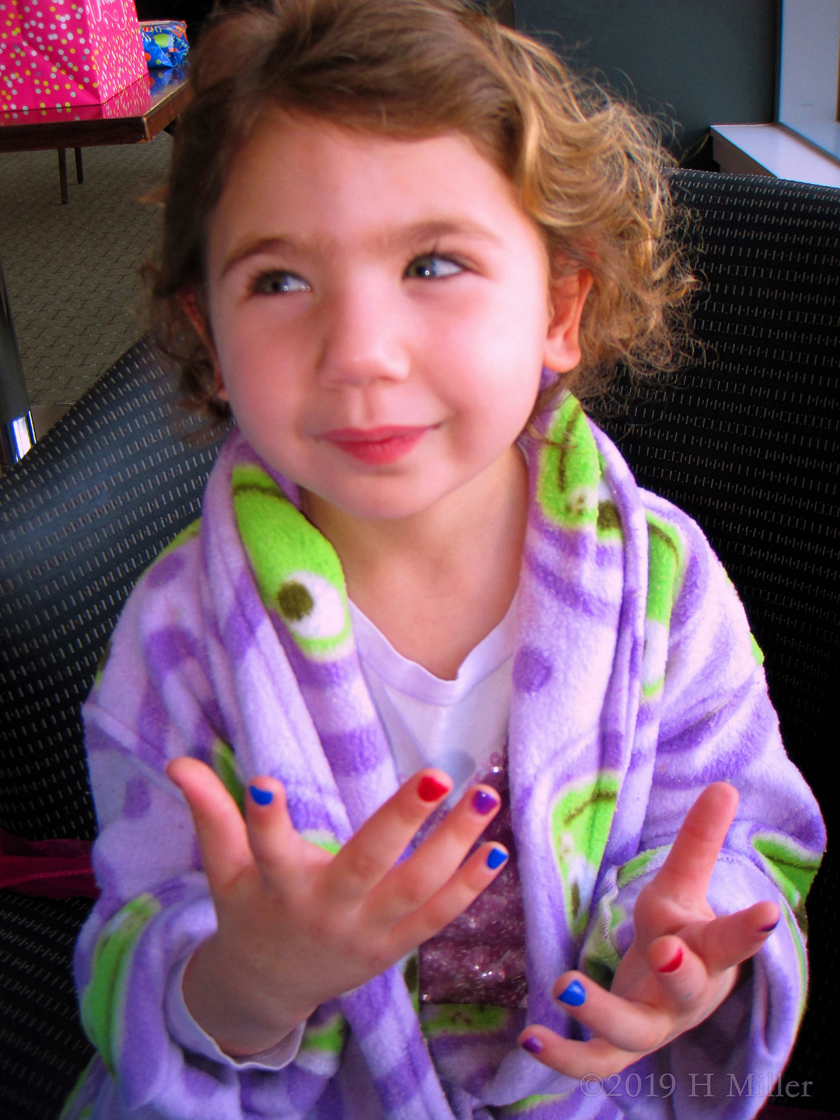 Showing Off Her Multicolored Kids Mini Mani 