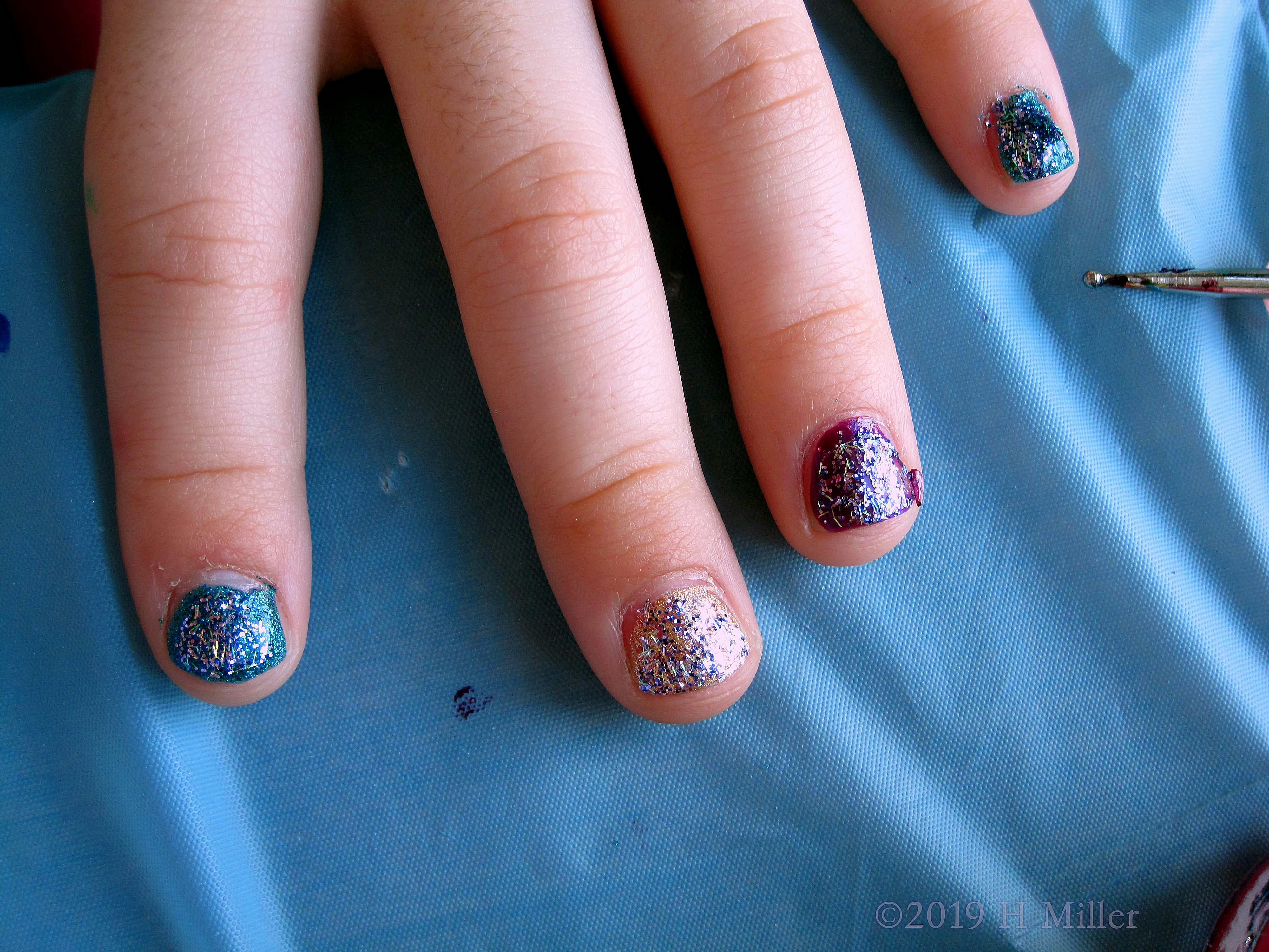 Beautiful Girls Mini Mani With Blue, Silver, And Burgundy Polish, With Glitter On Top! Beautiful Girls Mini Mani With Blue, Silver, And Burgundy Polish, With Glitter On Top!