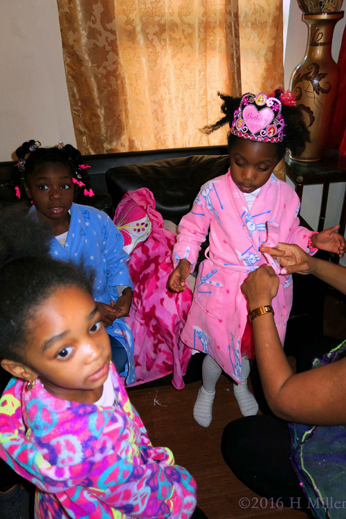 Helping One Of The Kids With Her Spa Robe Helping One Of The Kids With Her Spa Robe