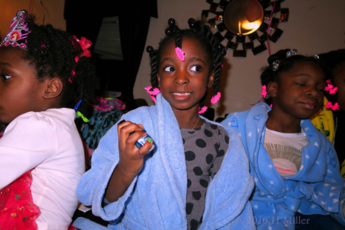 Holding The Nail Polish Bottle She Wants To Use For Her Kids Pedi. Holding The Nail Polish Bottle She Wants To Use For Her Kids Pedi.