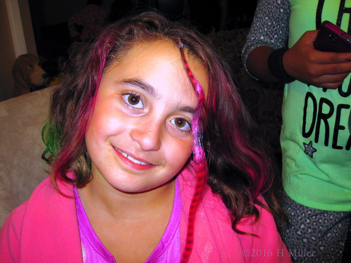 Looking Happy With A New Hair Color And Feather. 