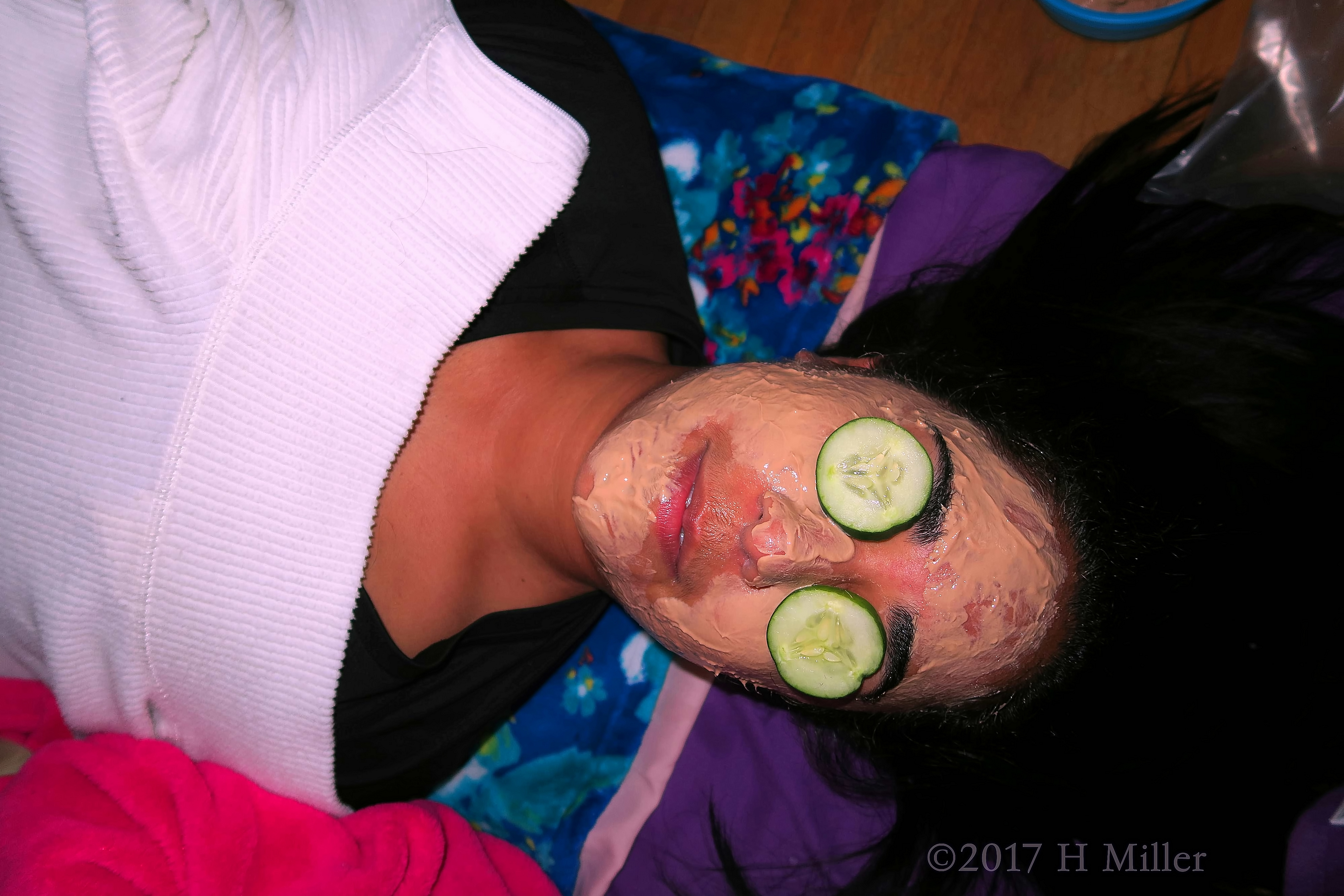 Her Facial Masque Is On With Cukes On Her Eyes! 