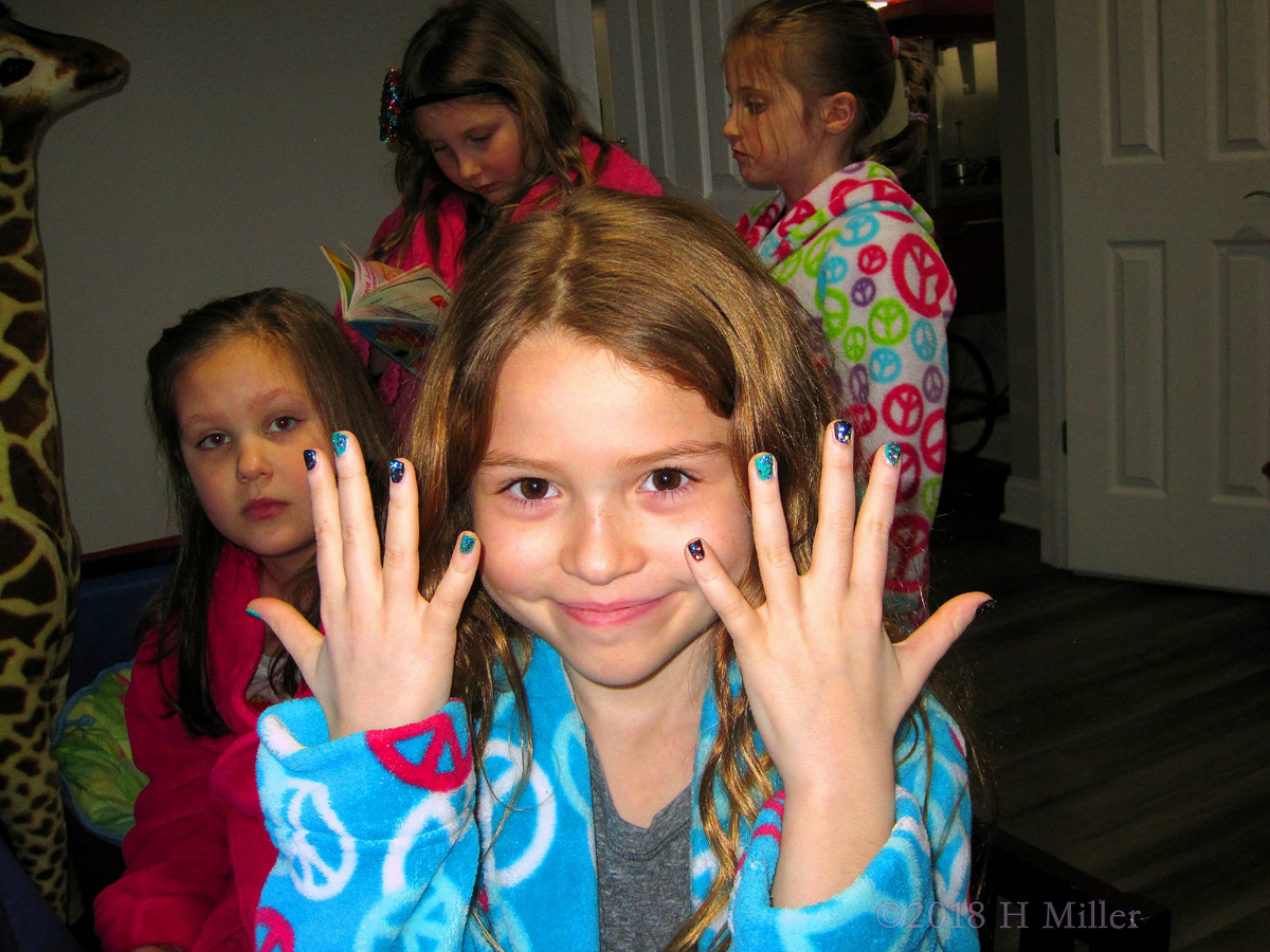 Kids Manicure With Blue, Black, And Teal Multicolored Sparkly Polish