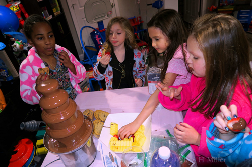 Party Guests At The Kids Spa Party Trying Fruit And Cookies In The Chocolate Fountain!