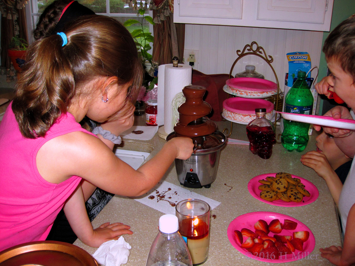 Dipping Strawberries Into The Chocolate Fondue! 