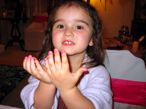 Smiling With Her Hot Pink Girls Manicure!