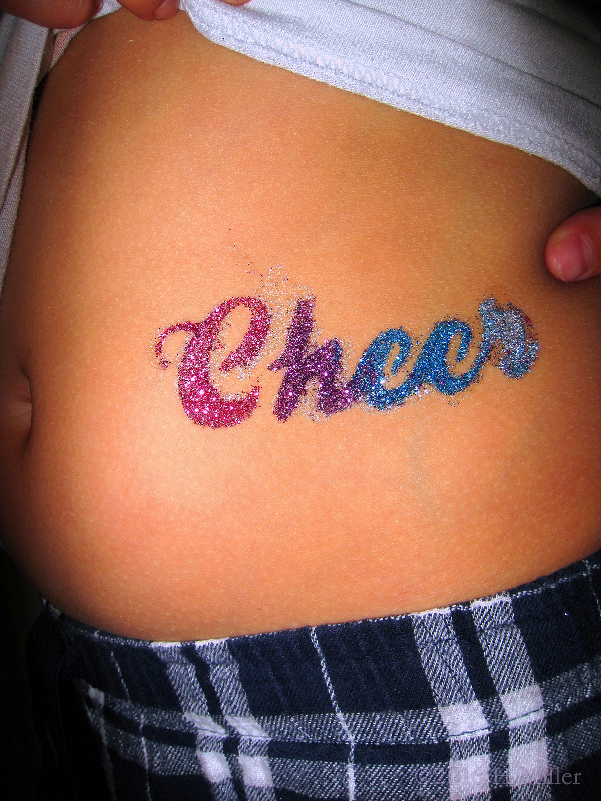 Cute Pink, Purple, And Blue Cheer Tattoo 
