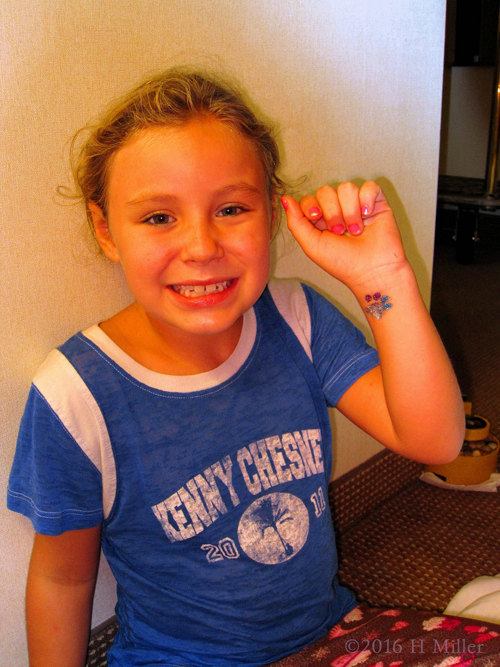 Smiling Big About Her Cute New Glittery Tattoo Smiling Big About Her Cute New Glittery Tattoo