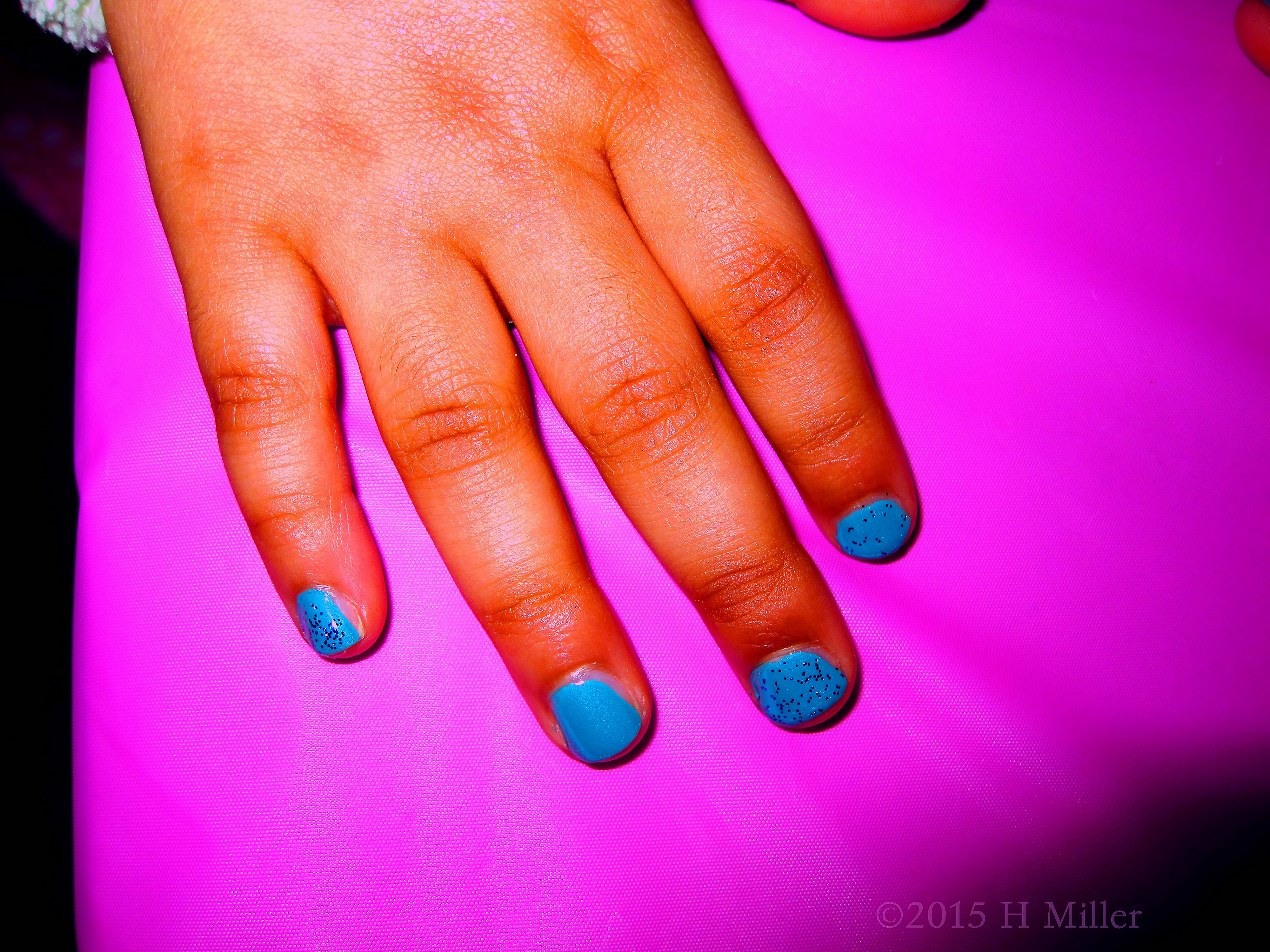 Blue Nail Poliash With A Little Glitter. Blue Nail Poliash With A Little Glitter.