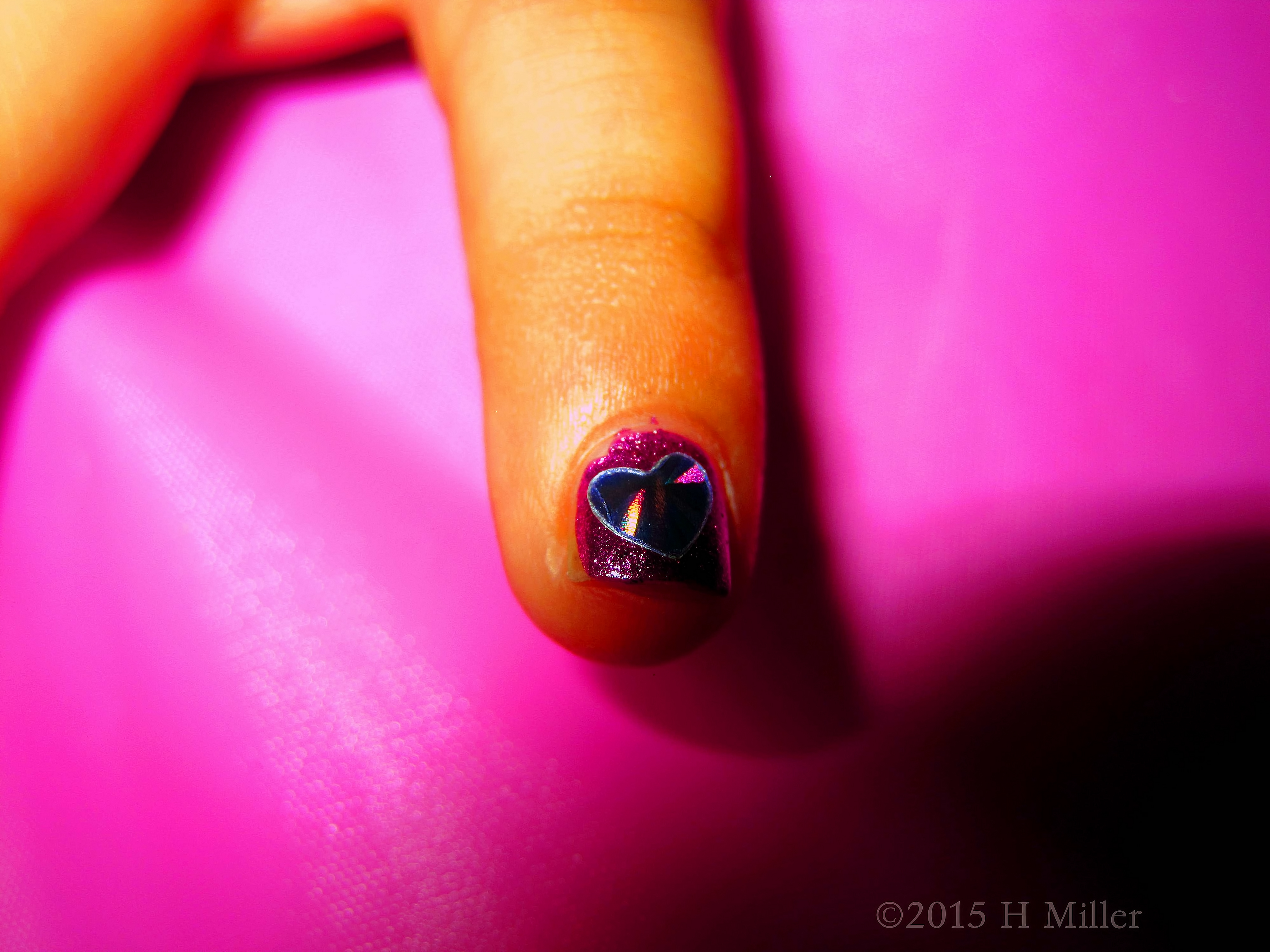 Holographic Heart Over Purple Nail Polish. 