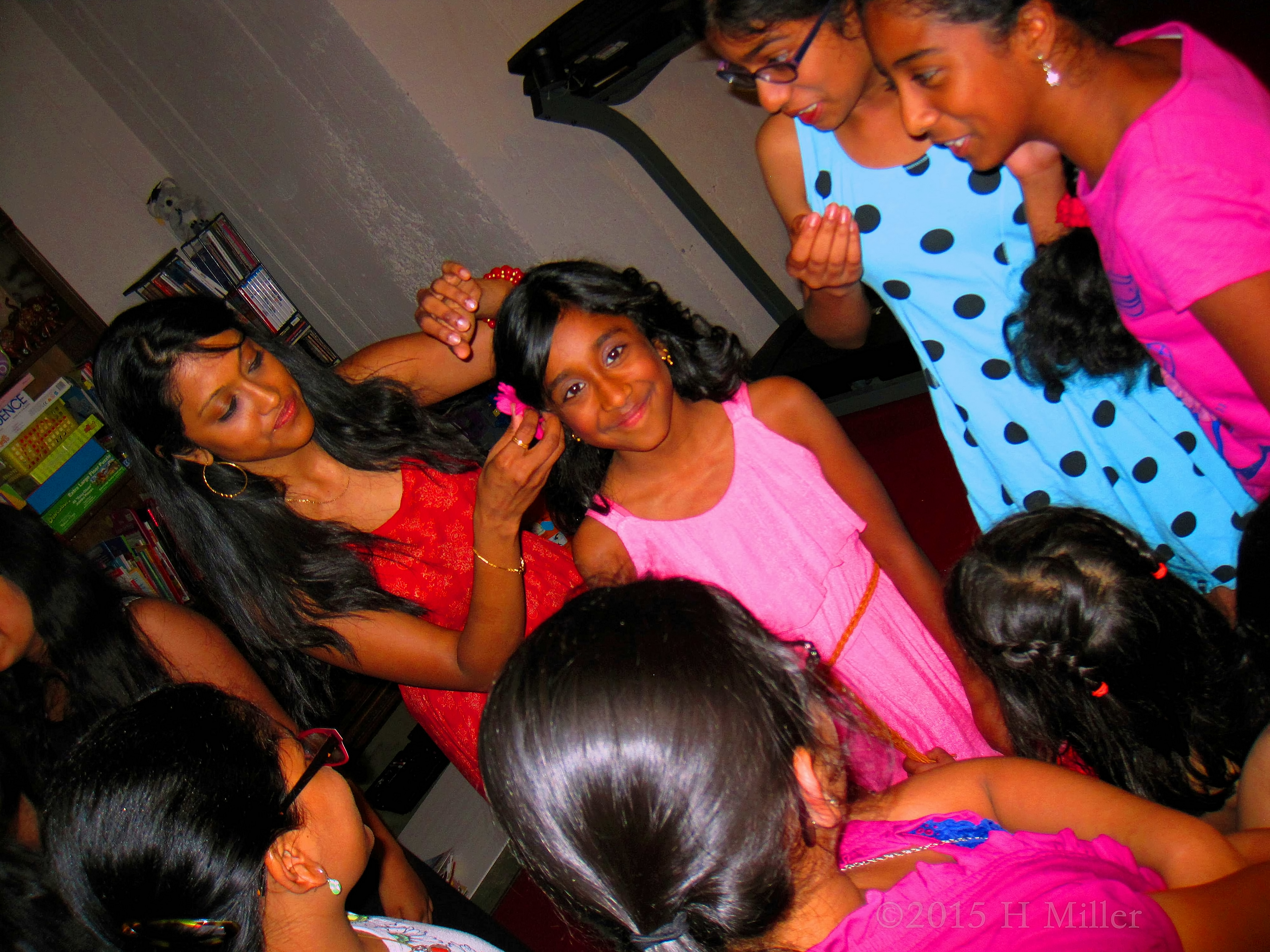 Mom Fixing Harini's Flower In Her Hair. Mom Fixing Harini's Flower In Her Hair.