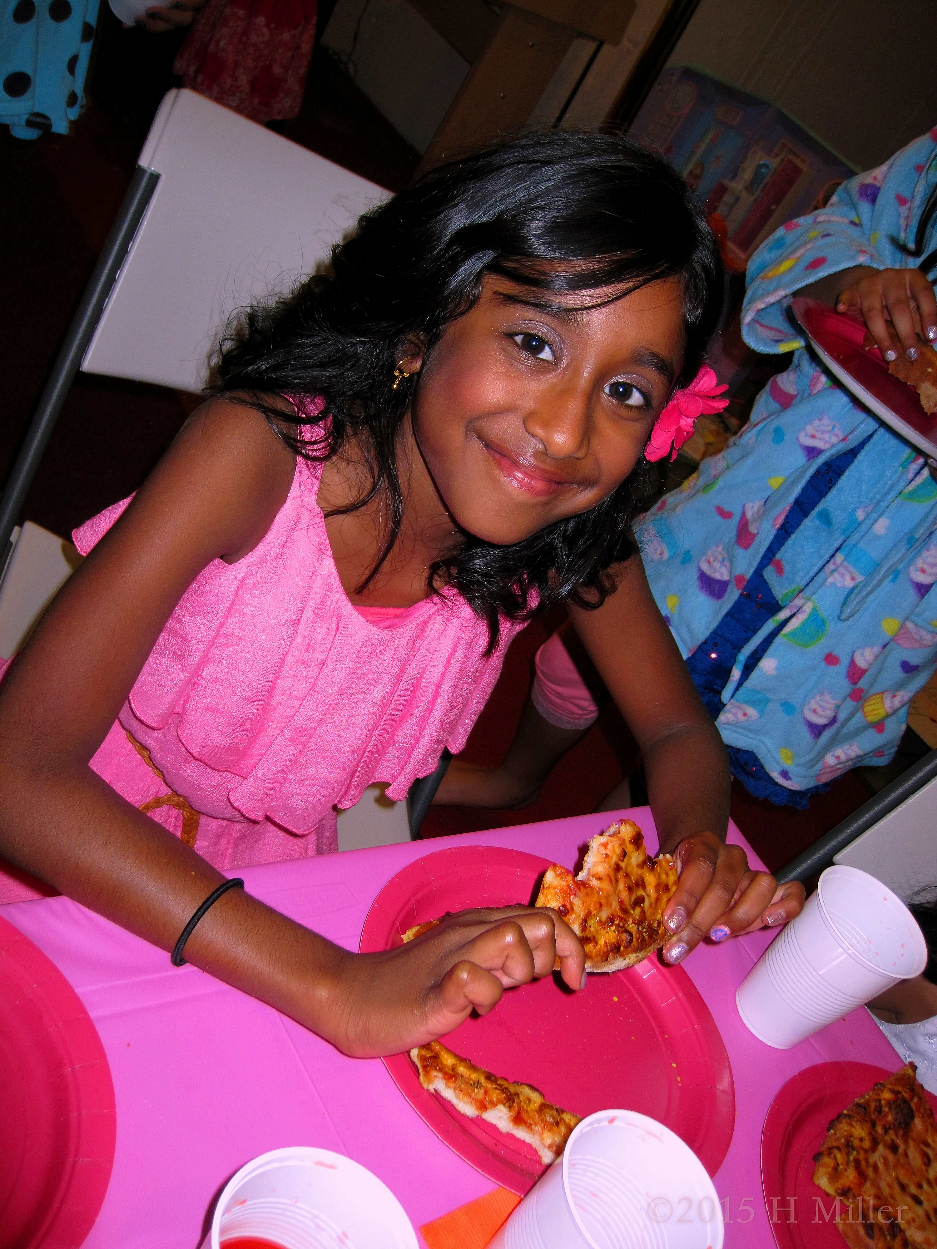 The Birthday Girl Pauses While Eating Pizza To Take A Photo The Birthday Girl Pauses While Eating Pizza To Take A Photo