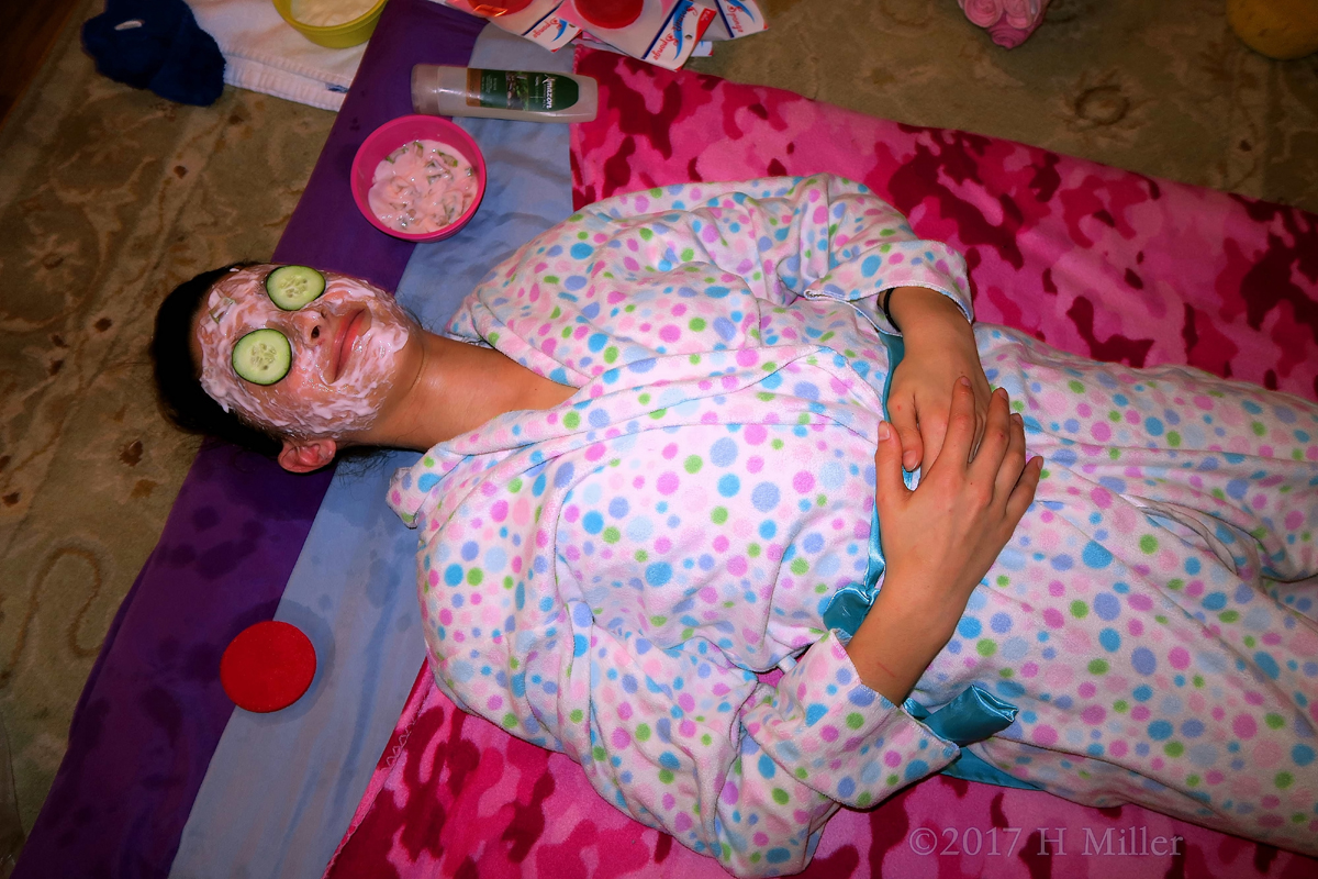 Girl Relaxing At During Facials For Kids 