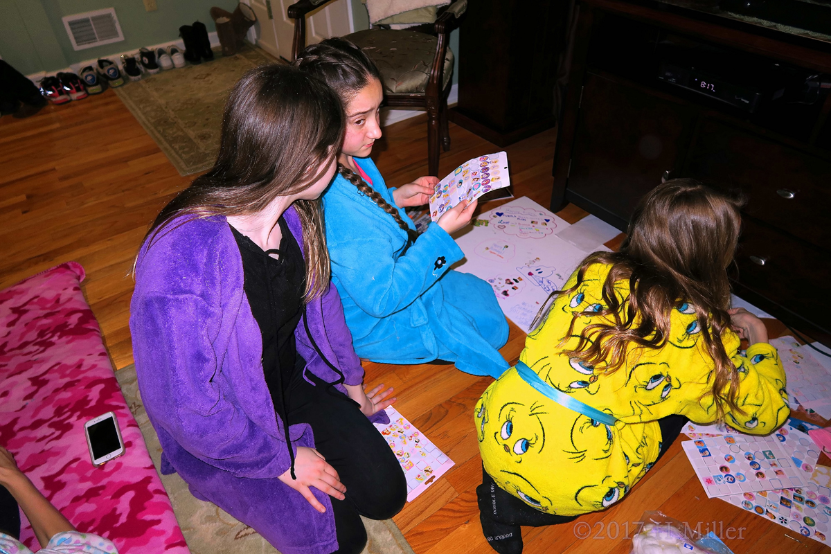 Girls Are Selecting Their Stickers For The Spa Birthday Card 