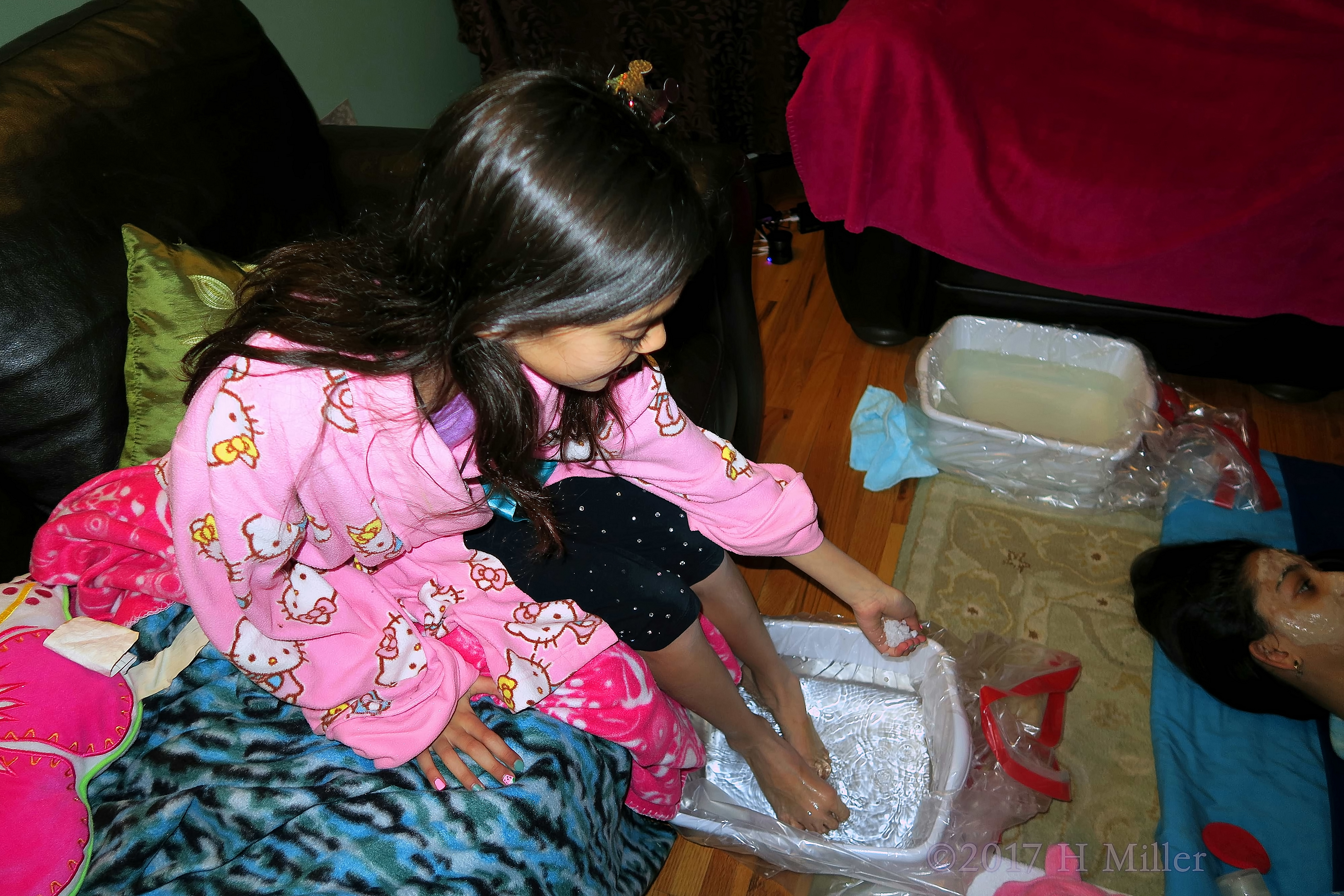 She Is Dropping Salt Into Her Pedicure At The Spa Party 