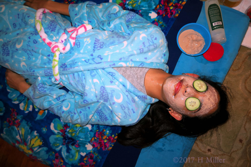 Birthday Girl Is Having A Yogurt Kids Facial With Cukes On Her Eyes Birthday Girl Is Having A Yogurt Kids Facial With Cukes On Her Eyes