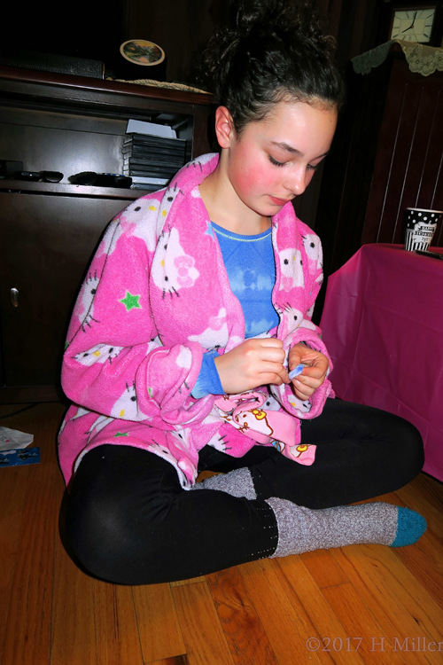 She Is Preparing Her Nails For Her Kids Manicure