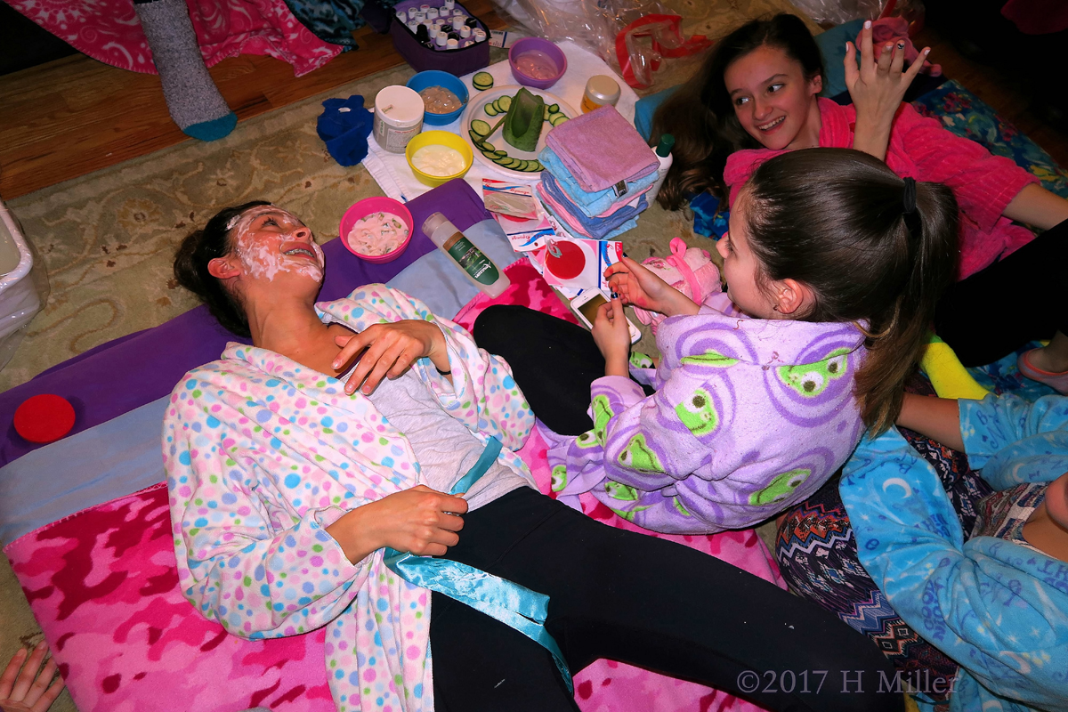 Smiling Girls Chilling During Facials And Other Spa Birthday Party Activities.