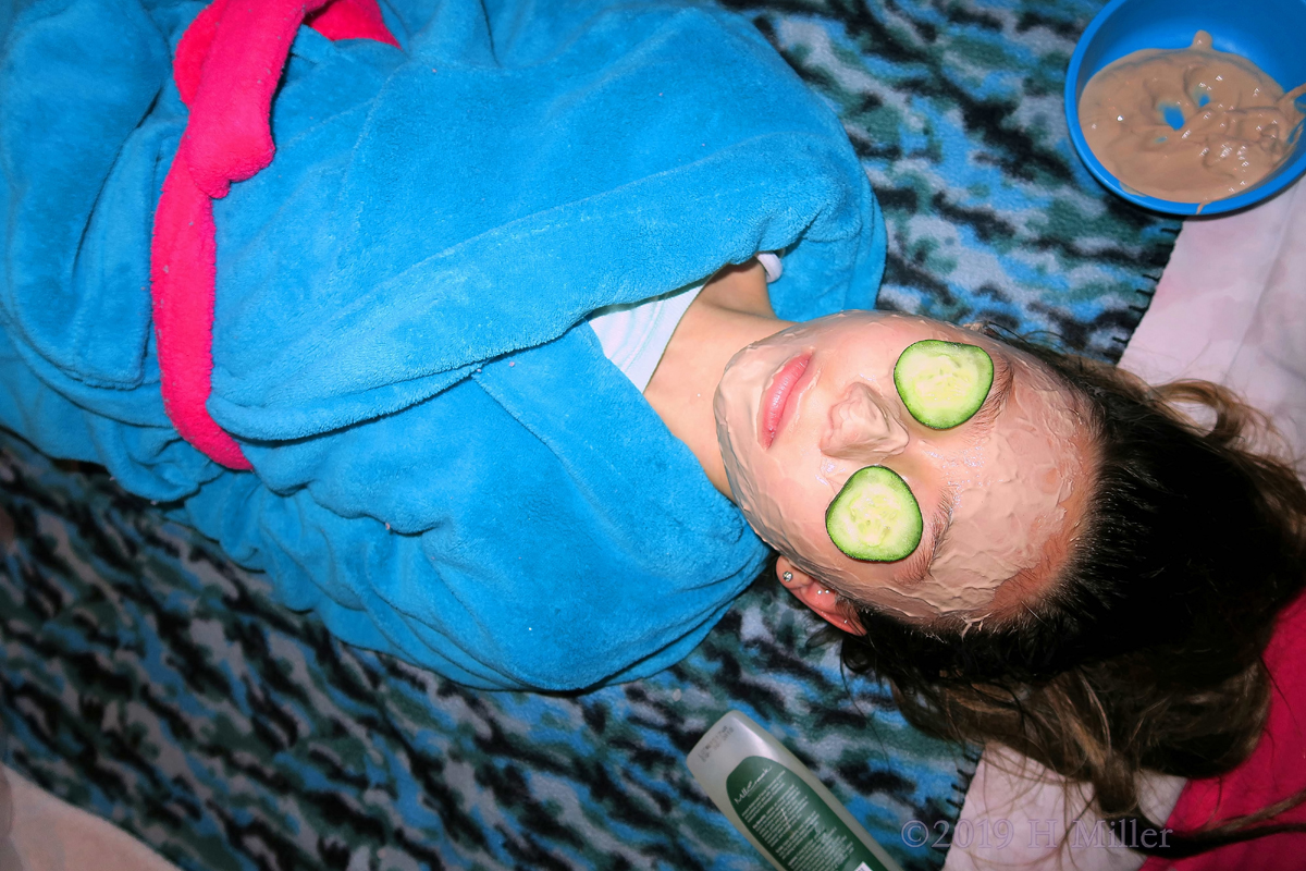 She Is Getting A Chocolate Kids Facial With Cukes On Her Eyes 
