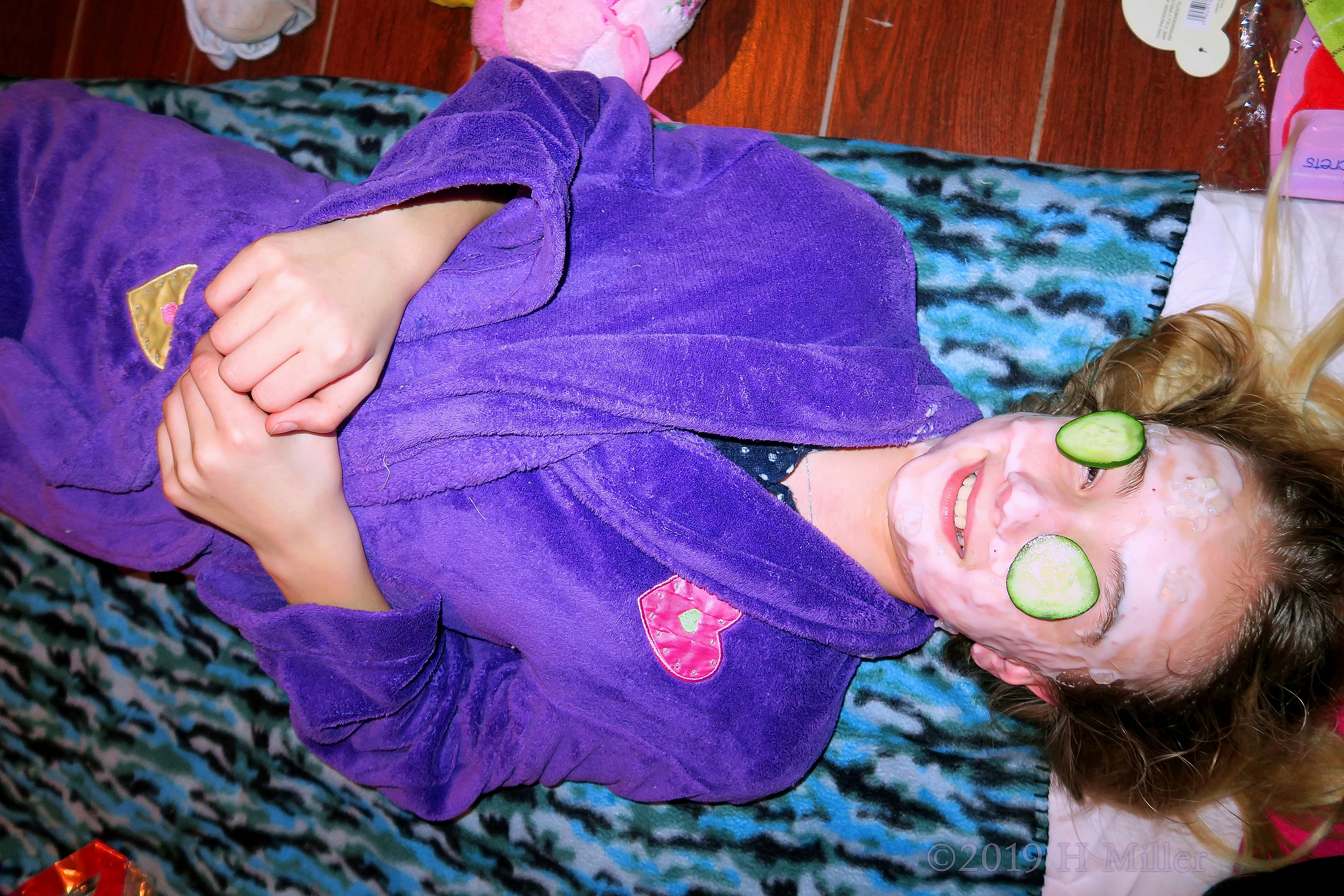 Having A Kids Facial With Cukes On Her Eyes Having A Kids Facial With Cukes On Her Eyes