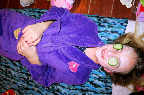 Having A Kids Facial With Cukes On Her Eyes Having A Kids Facial With Cukes On Her Eyes