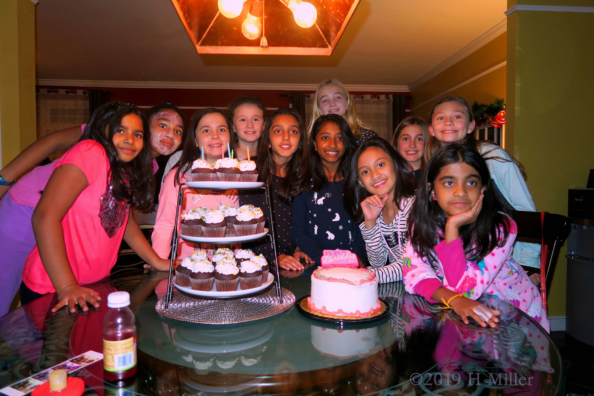 Girls Are Taking Pictures With The Cupcakes And Cool Birthday Cake! They Can't Wait To Try Them! 